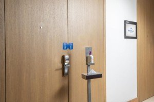 Meeting room door seal and disinfection station